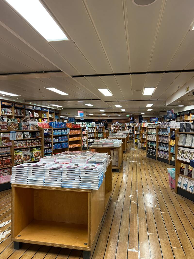 rows-with-colorful-books-shelves-bookstore